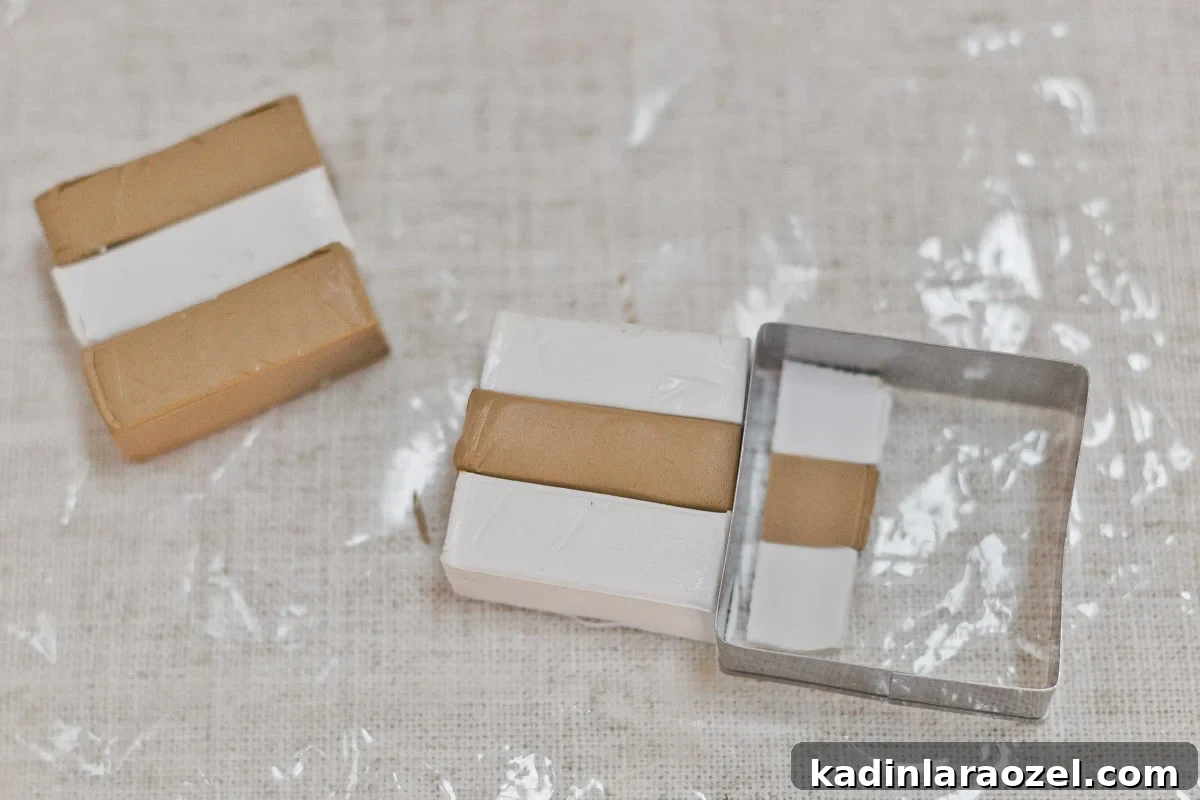 Cutting two colors of oven bake clay with square cutter.