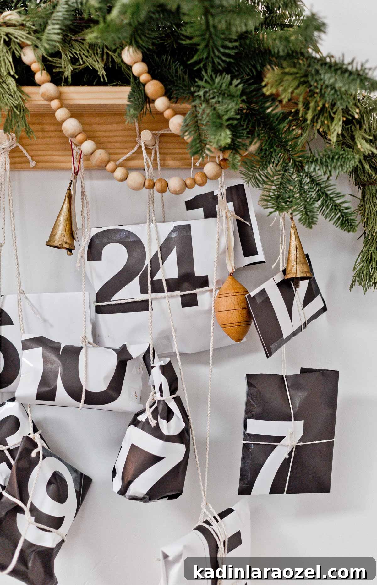 50 Advent Calendar Ideas to Delight Every Day in December 11 Modern advent calendar with calendar pages and garland