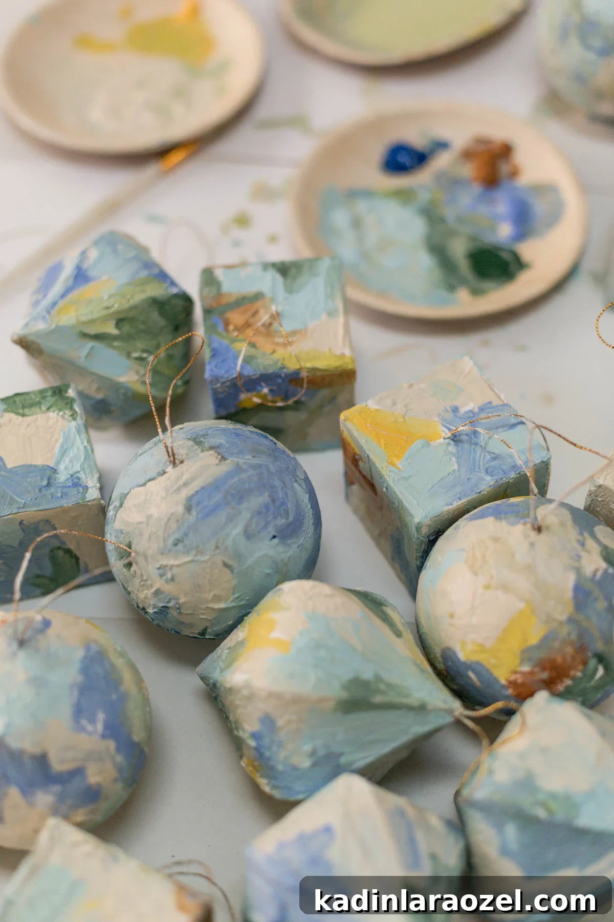 Painted plaster ornaments in geometric shapes on table
