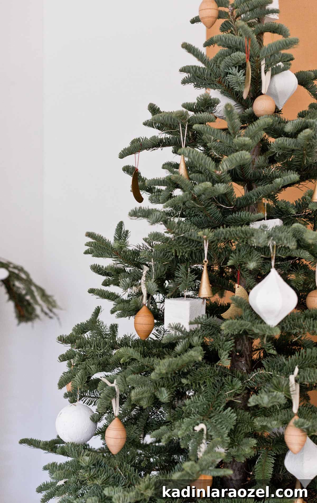 Neutral organic modern Christmas tree decorating