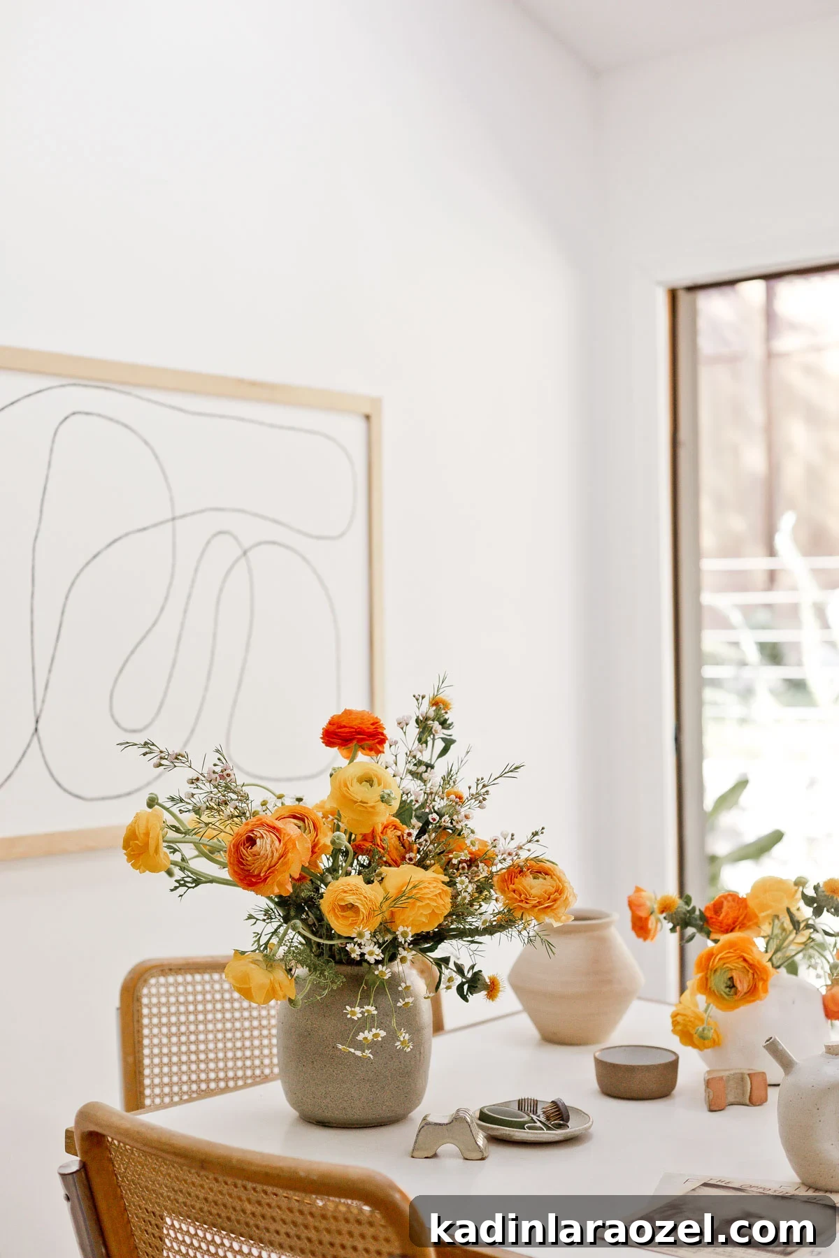 7 Pro Flower Arrangement Tips for Stunning Home Displays 3 Yellow and orange floral arrangement on white mid century table