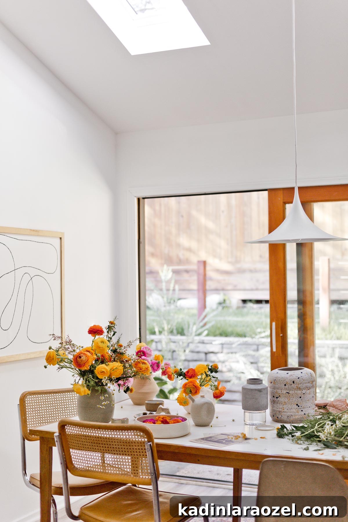 7 Pro Flower Arrangement Tips for Stunning Home Displays 10 Flowers and vases on white and wood table in mid century dining room