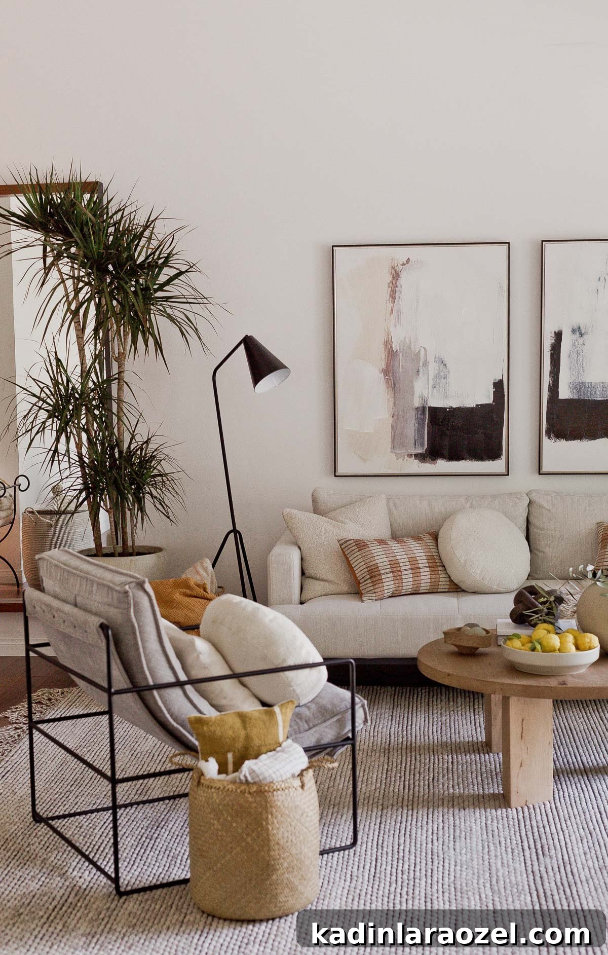Ivory sofa and large soft rug with wood coffee table and modern black accents