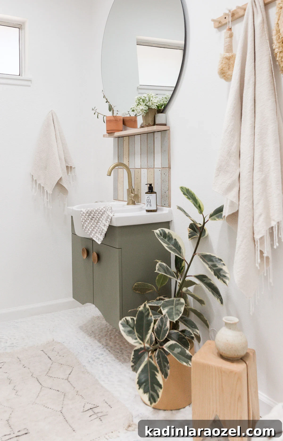 Small Bathroom Makeovers on a Budget: Before and After Ideas 2 Light and bright small bathroom with white rock floors and white towel hanging from the wall