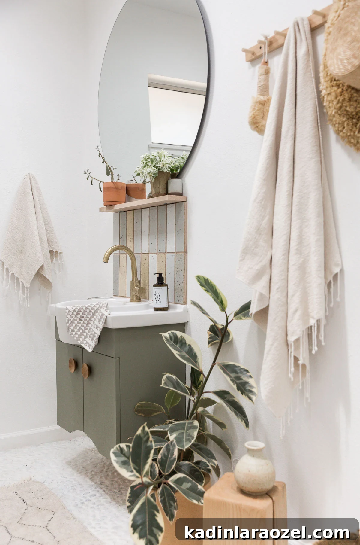 Small Bathroom Makeovers on a Budget: Before and After Ideas 7 Muted green vanity in small minimal guest bathroom