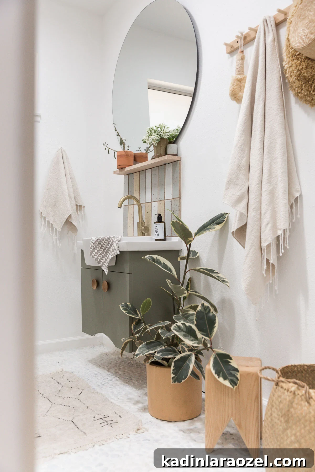Small Bathroom Makeovers on a Budget: Before and After Ideas 8 Painted white floors and green floating vanity in small guest bathroom with organic modern style
