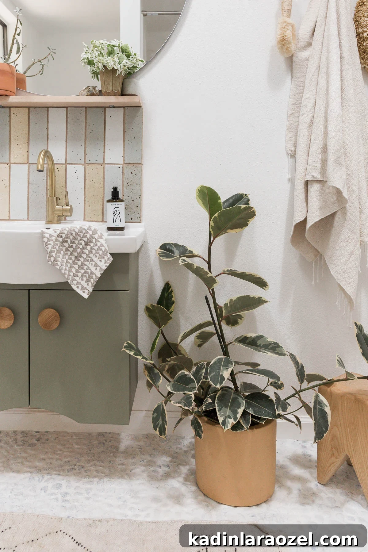 How to Paint Tile Floors: Step-by-Step Tutorial and Tips 5 White river rock bathroom floors with green cabinetry and plants