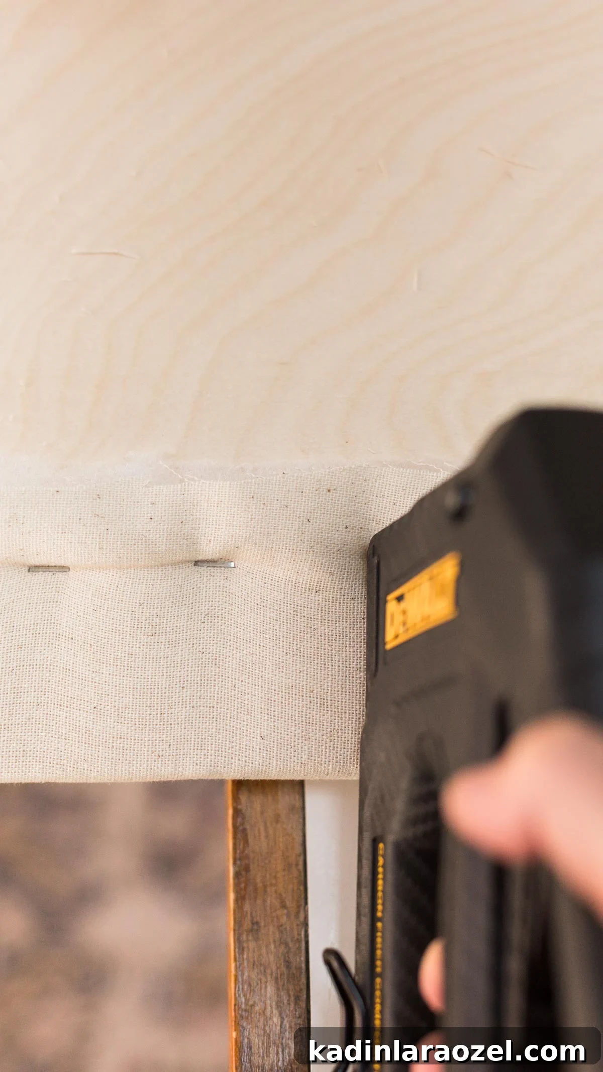 DIY Upholstered Headboard: Step-by-Step Project Guide 5 Stapling fabric to a piece of wood to create a headboard