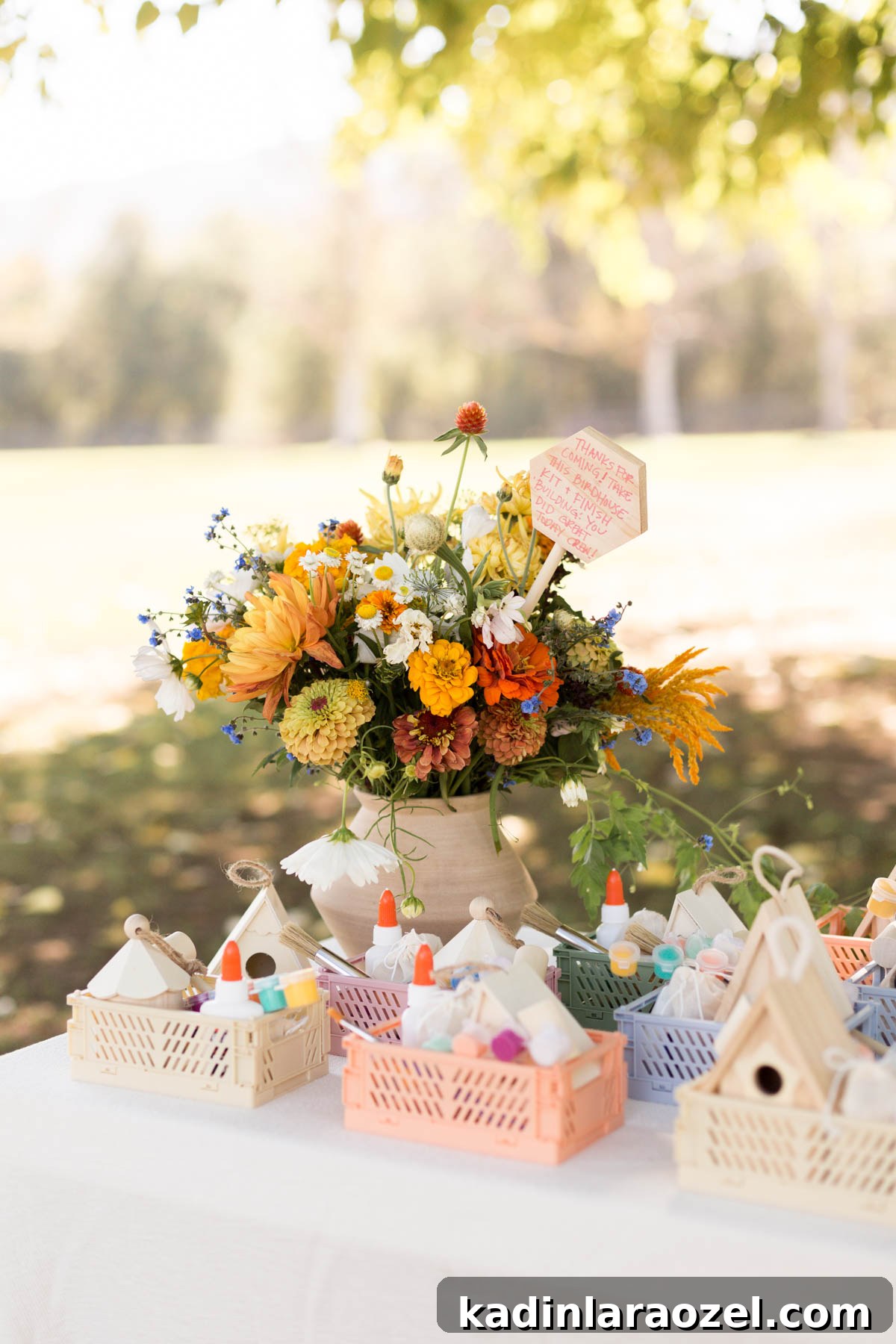 Birdhouse Craft Kits for Kids Party Favors 9 Autumn floral bouquets on white tablecloth with party favors lined up
