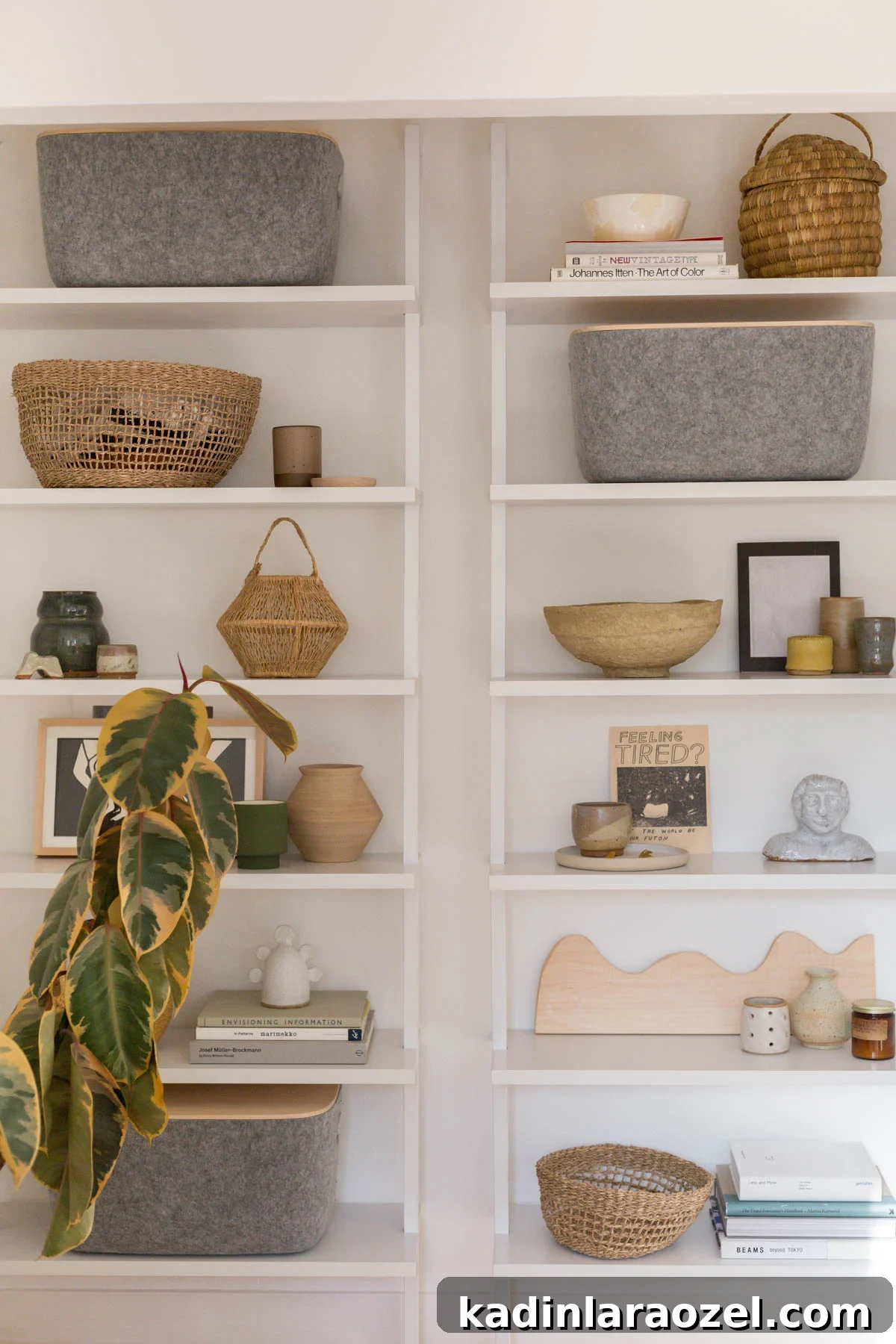 Closet Makeover: Transform Clutter Into a Stylish, Organized Space 5 White wall shelves styled with woven baskets, small ceramics, and plants.