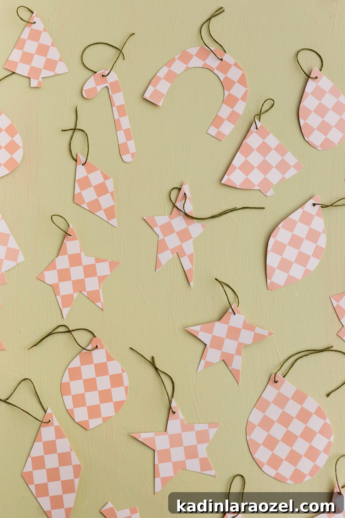 pink checkered ornaments that were made from paper plates