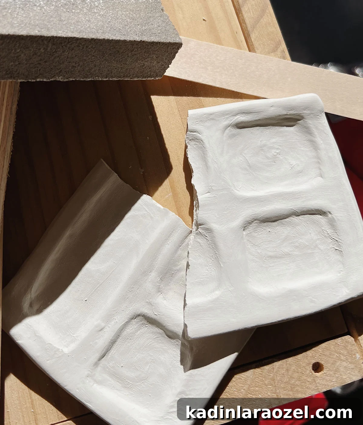 Broken white paint palette made of clay, closeup
