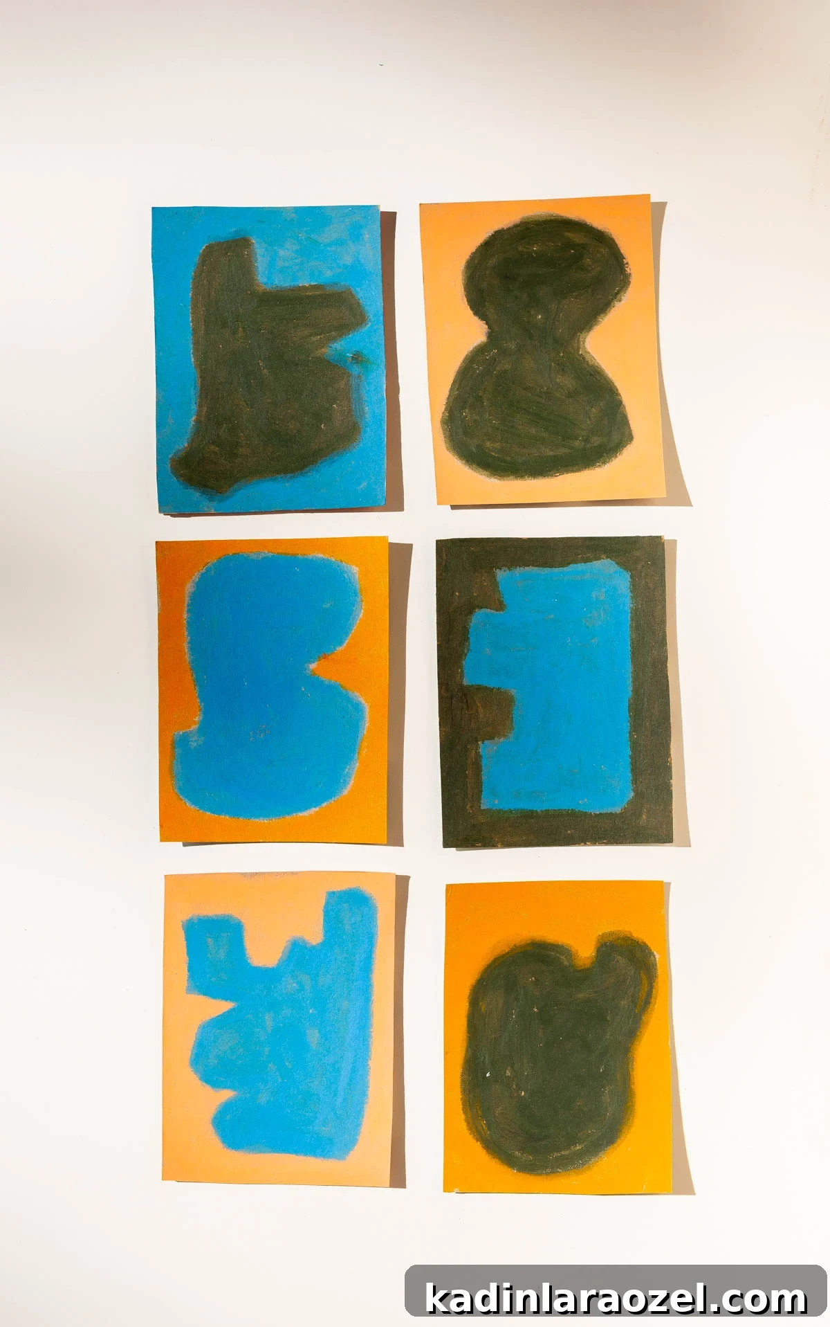 Six pieces of abstract wall art, lined up in a grid.