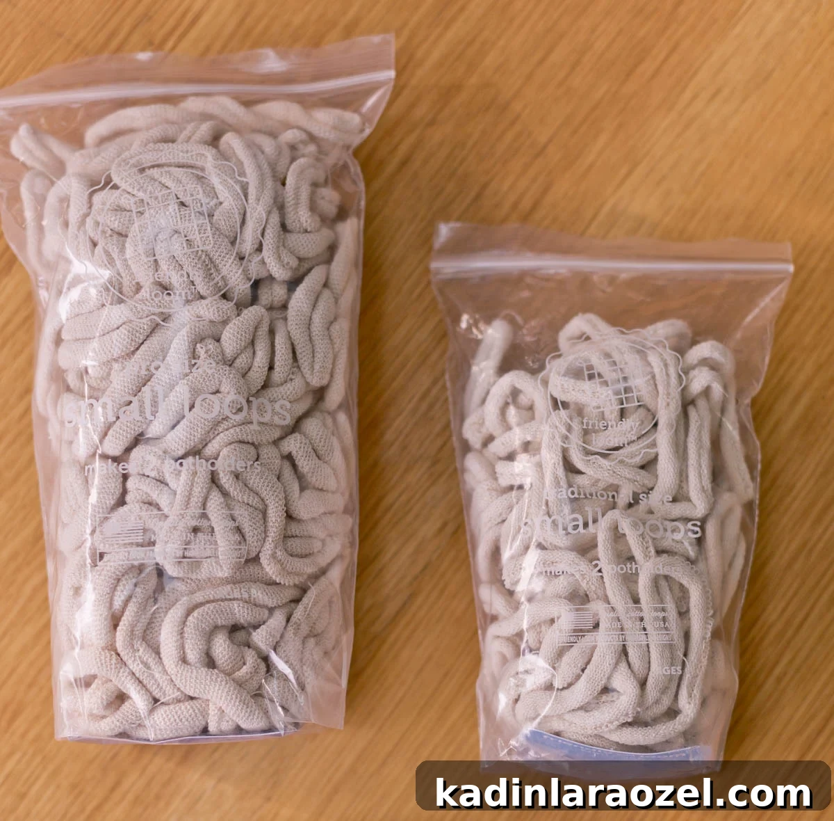 Potholder Loom Weaving: DIY Projects and Techniques 5 beige potholder loops in two different sizes, both inside clear bags
