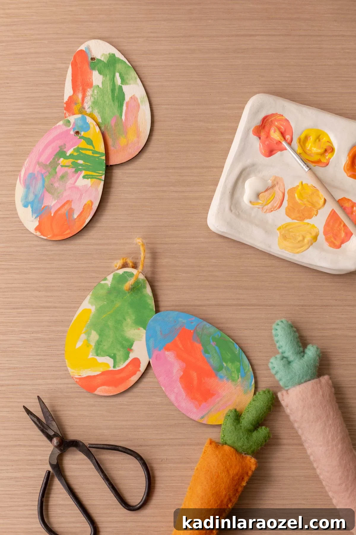 Painted wooden Easter egg tags with paint palette and felt carrots