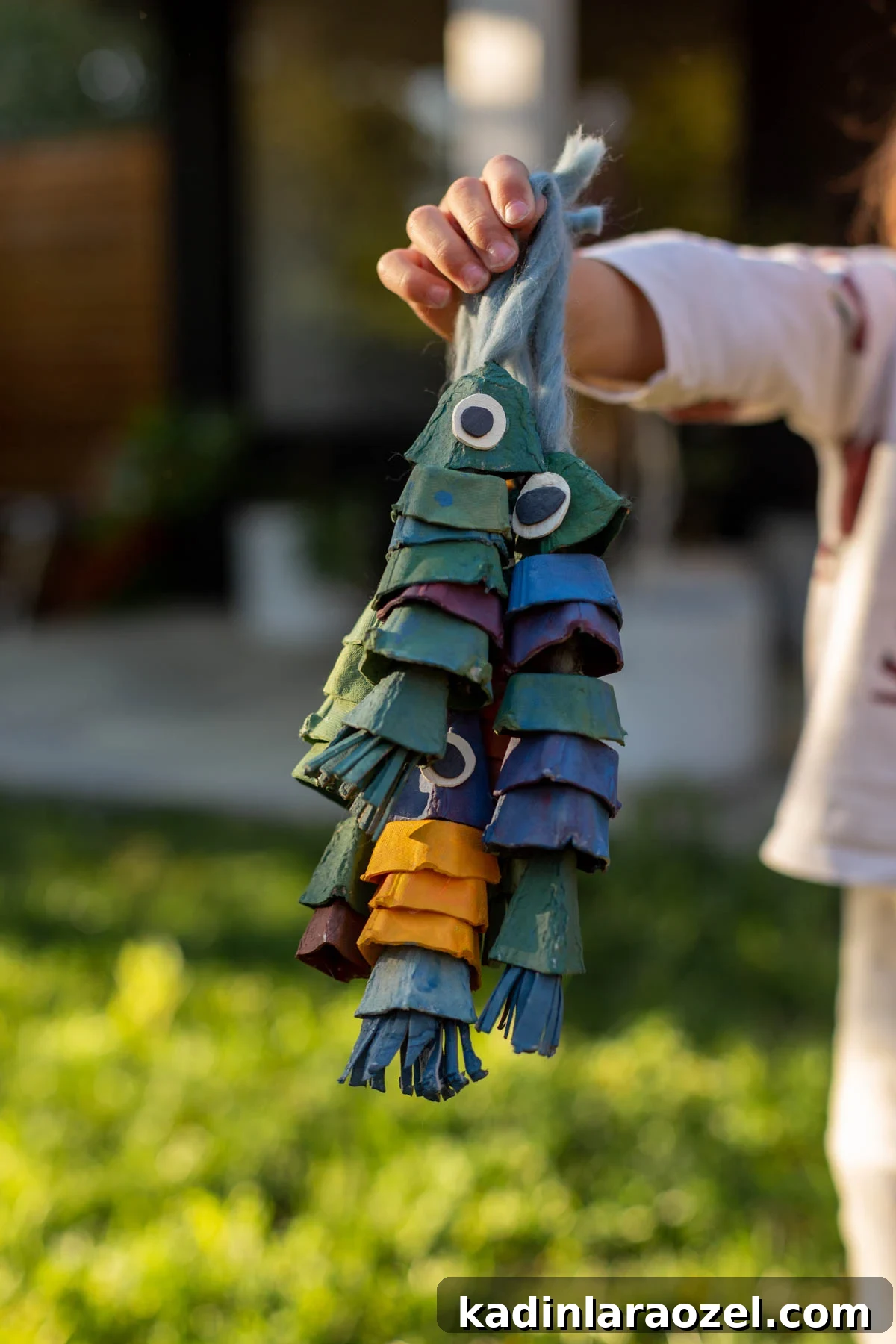 DIY Egg Carton Fish Craft: Make Colorful Fish from Egg Cartons for Kids 6 Closeup of green and blue fish made of painted egg cartons
