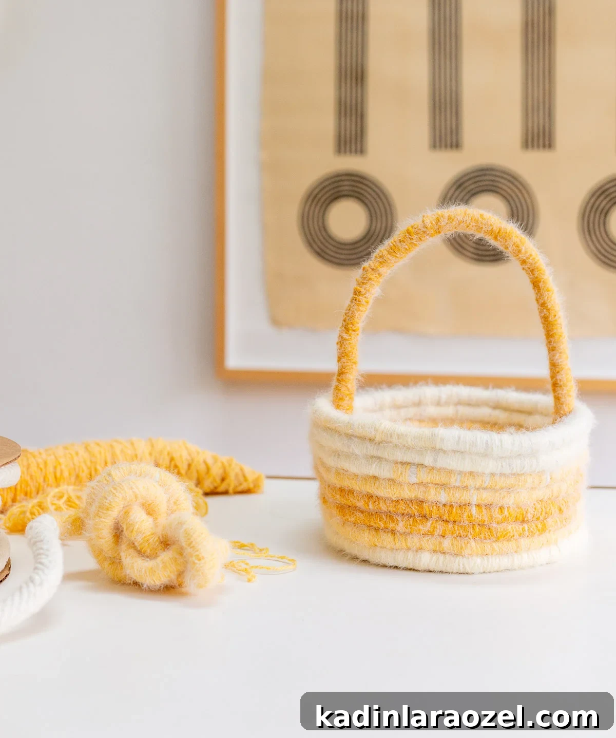 Make an Easter Basket from Scratch: Step-by-Step DIY Guide 2 yellow easter basket made of yarn, sitting on a white table in a minimal dining room