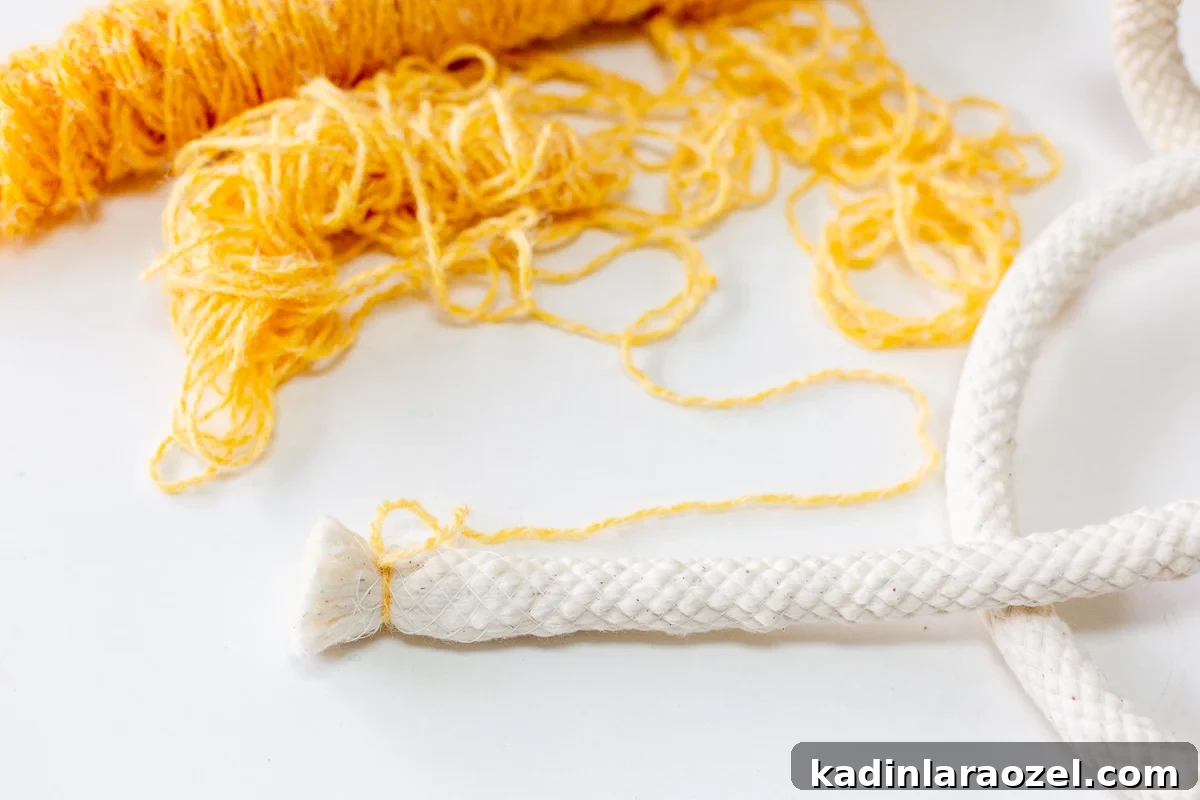 Make an Easter Basket from Scratch: Step-by-Step DIY Guide 5 yellow yarn being wrapped around cotton cording