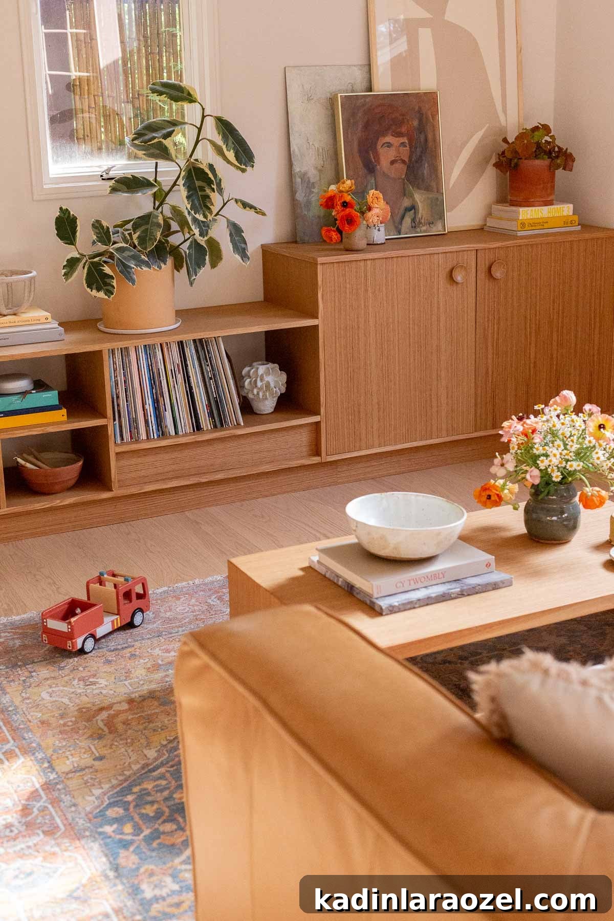 Wood built in shelves and cabinetry with mid-century style in an earthy modern seating area