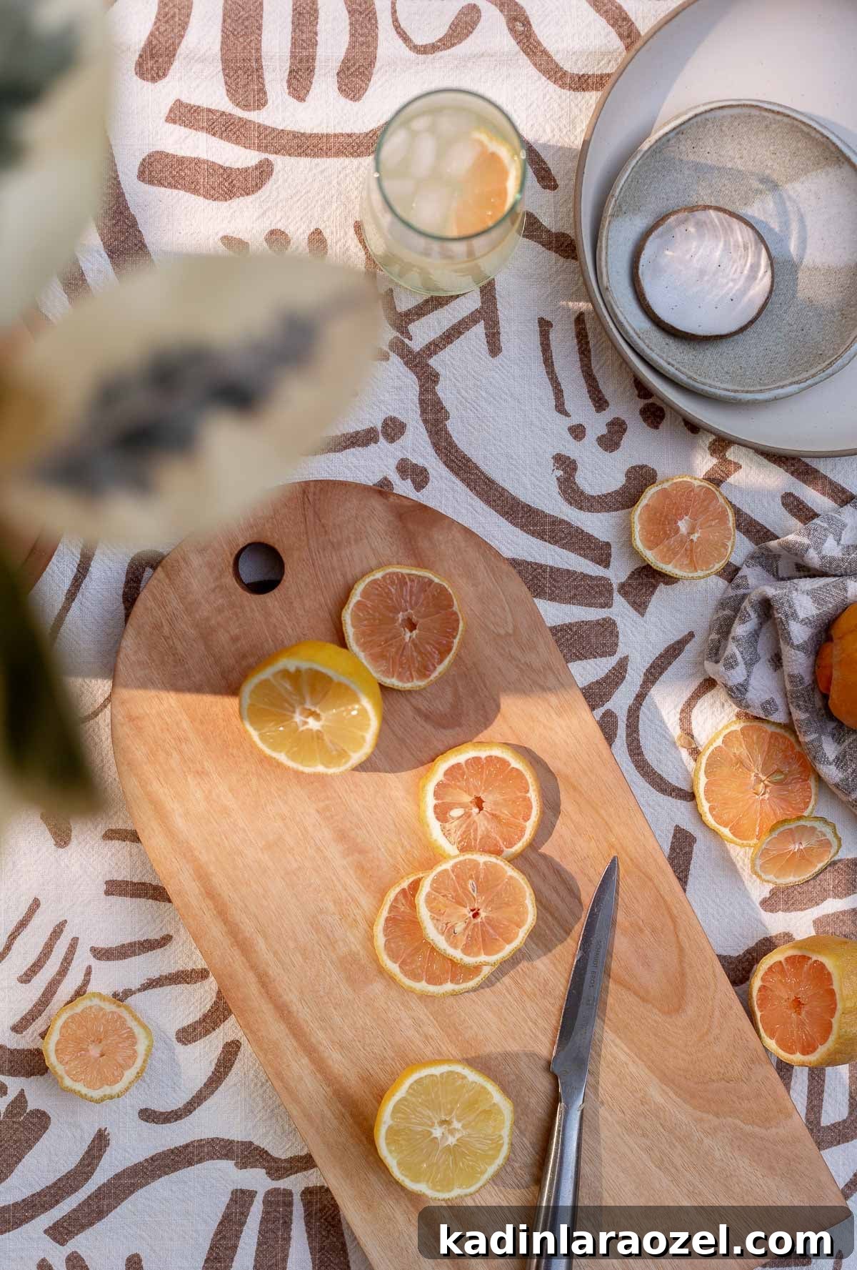 sliced citrus on arch cutting board with minimal modern details