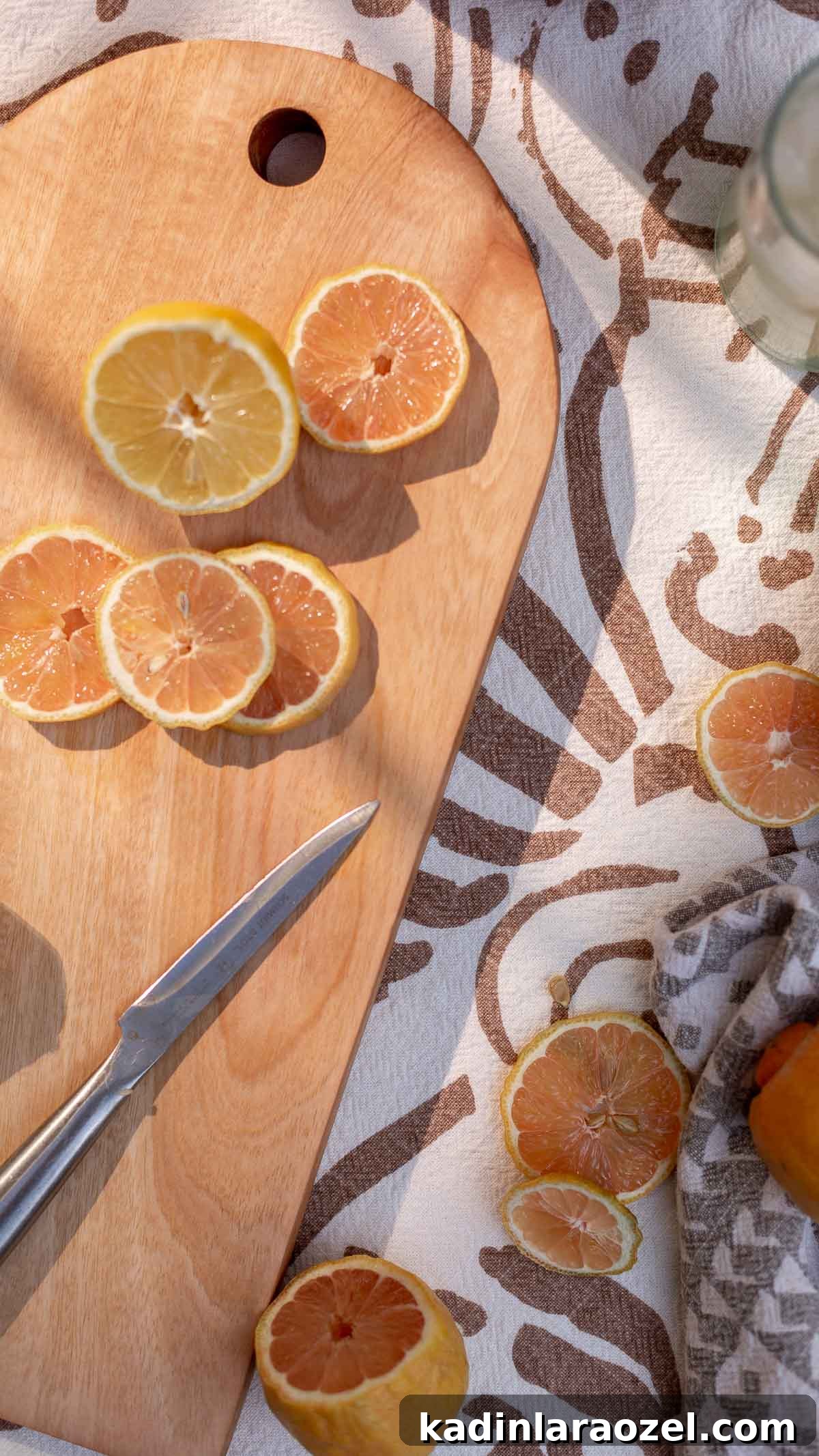cutting with citrus and knife on table outdoors