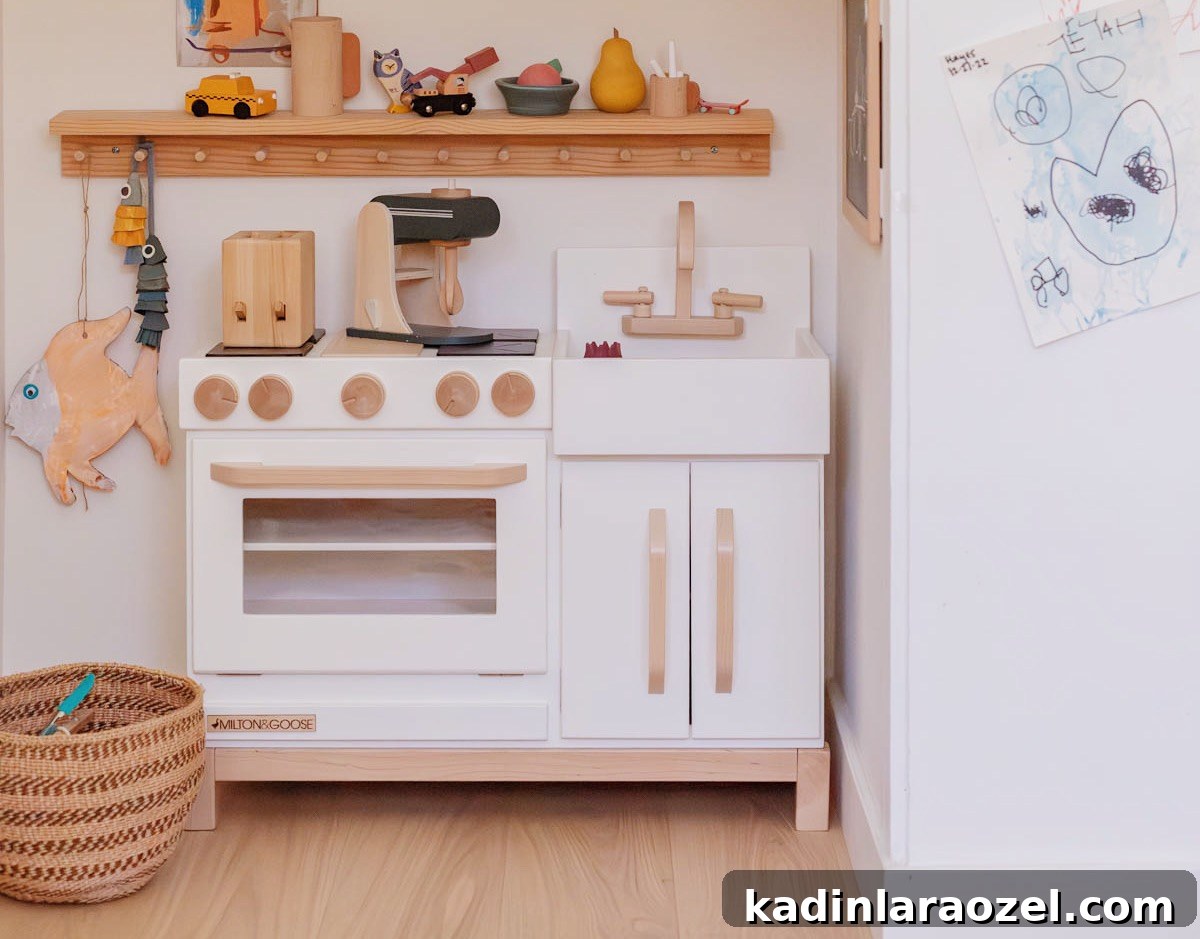 wooden play kitchen in kids room with wood kitchen accessories and baskets