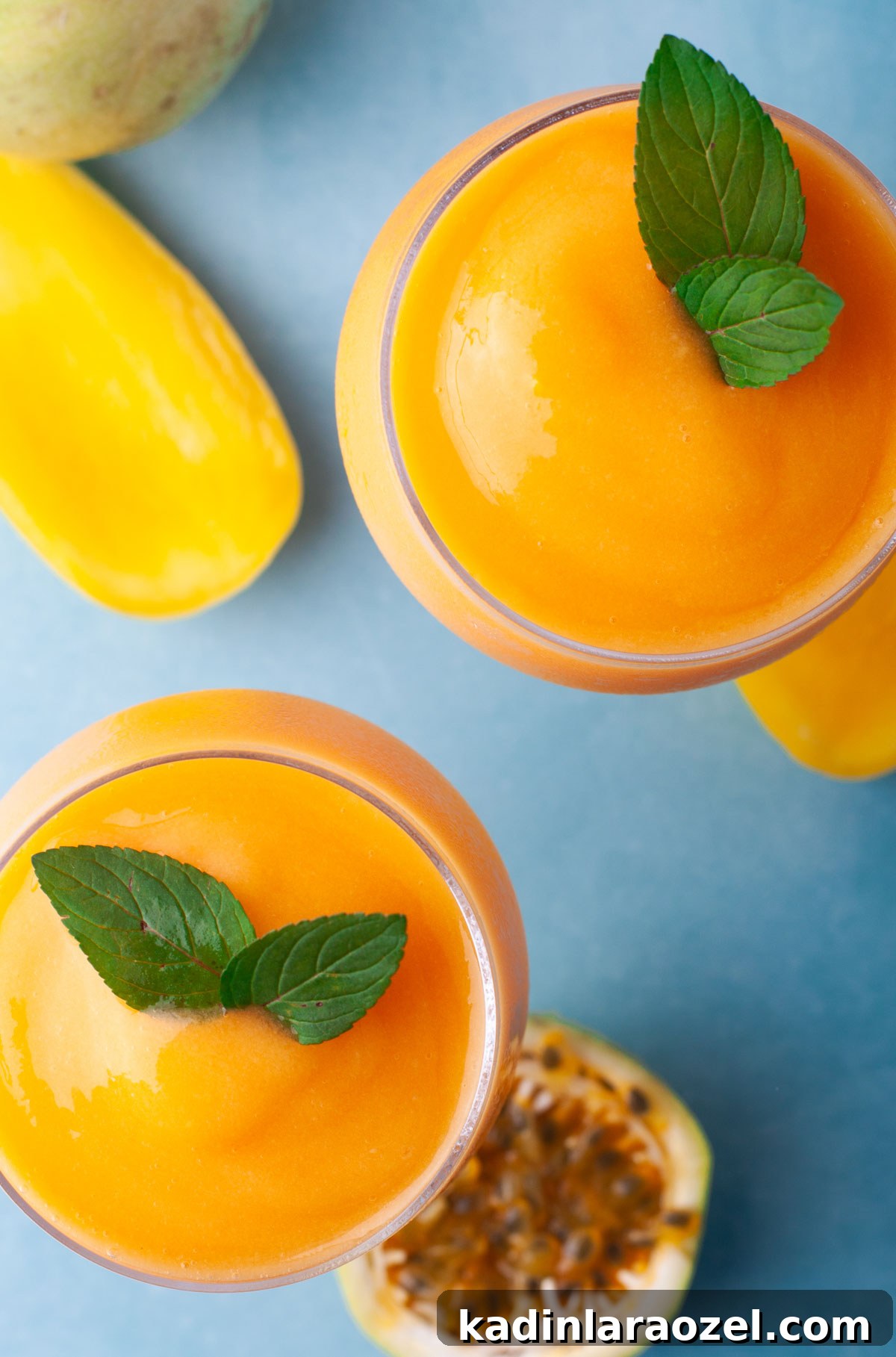 17 Refreshing Summer Cocktails to Try Now 11 orange frozen aperol spritz with mint garnish