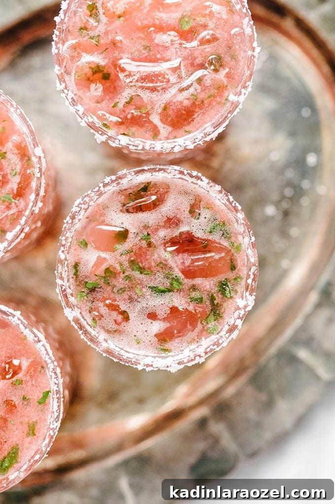 17 Refreshing Summer Cocktails to Try Now 10 strawberry basil margaritas, with salt rim, and served on a silver tray
